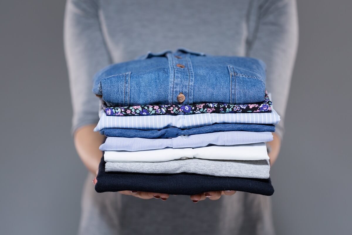 Laura Blog - Spring Cleaning 2019 - Closet - Tips - Stack of Clothing