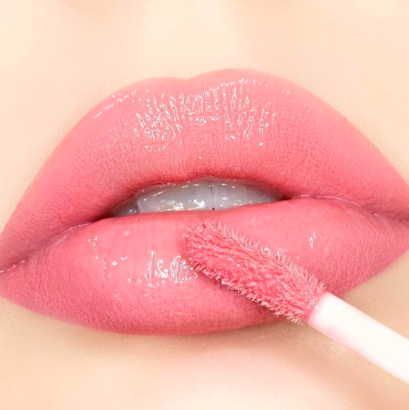 Close up of lips with lip gloss application