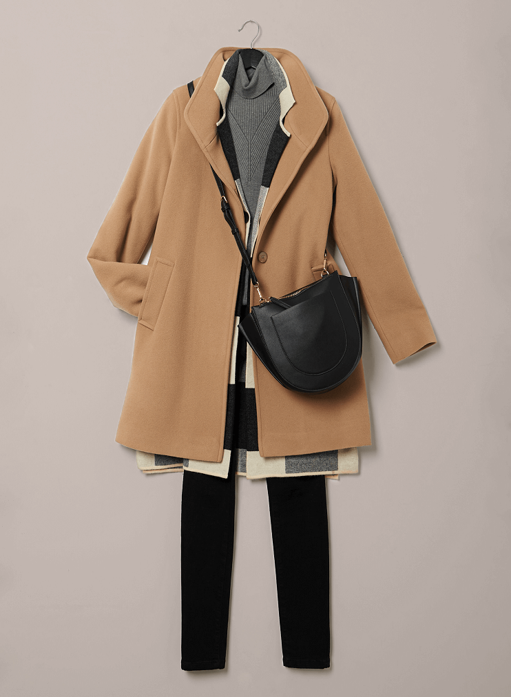 Wool and cashmere coat paired with cardigan, turtleneck, pants, and crossbody bag