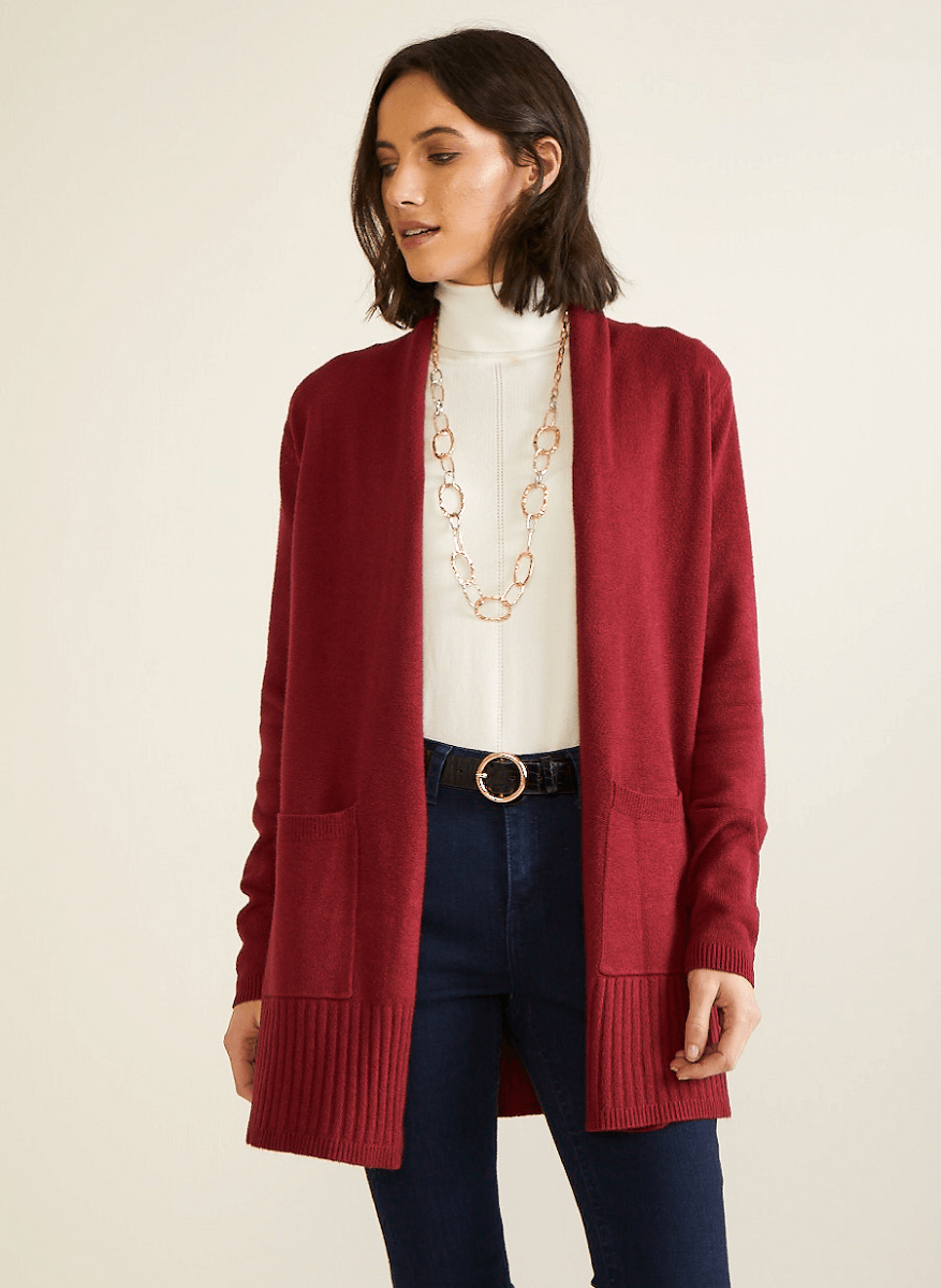 Red cardigan on top of white sleeveless sweater