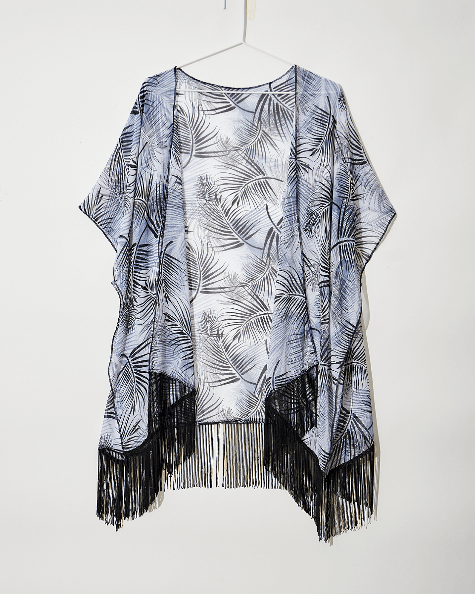 A flat shot of a leaf print cover-up with tassels